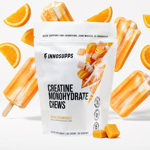 Inno Supps Orange Creamsicle Creatine Monohydrate Chews pouch displayed with orange creamsicle popsicles, orange slices, and two creatine chews.